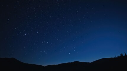 Stunning night landscape featuring the bright Milky Way galaxy over majestic mountains. A breathtaking starry sky perfect for nature, astronomy, and adventure themes.