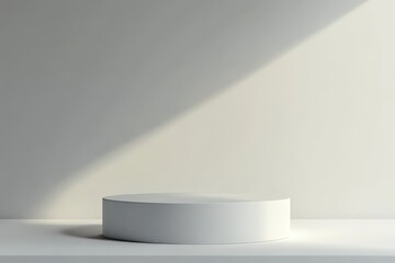 A minimalist white pedestal stands in a brightly lit room setting