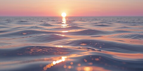 Obraz premium Golden sunlight reflections on rippling water surface at sunset