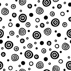 Seamless black and white pattern of hand-drawn marker centric circles, balls and dots