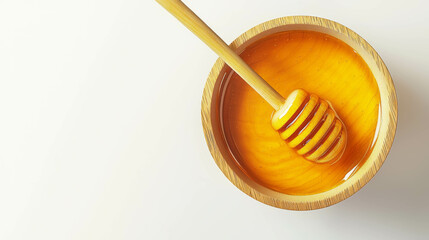 Golden honey in wooden bowl with honey dipper - sweet and natural