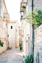 Narrow street of an ancient town with stone houses