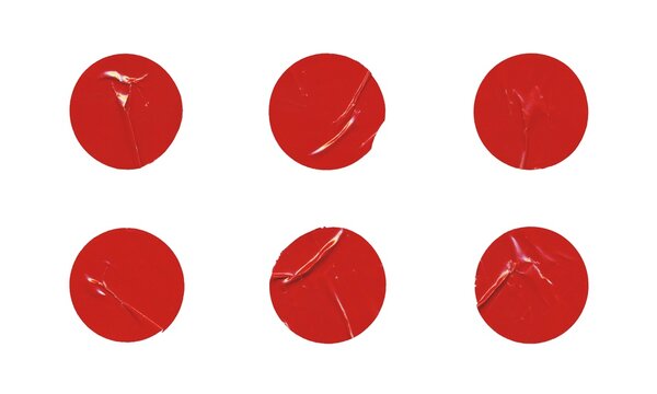 Set of six red glossy paper circles with creases, blank round sticker on white background