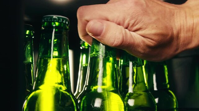 Row of beer bottles in fridge, shop or hotel, cold lager craft german beer or cider, shop supermarket or wine cooler close up.