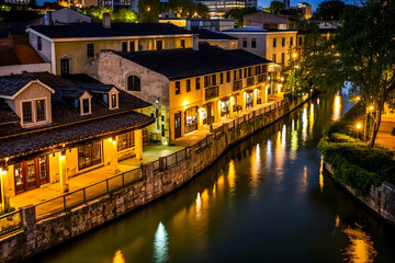 Old European town night reflections on river