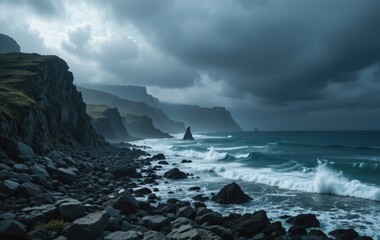 Obraz premium Dramatic Rocky Coastline with Crashing Waves and Overcast Sky Landscape