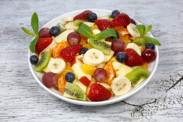 fresh fruit salad on the rustic white wood meyve salatası