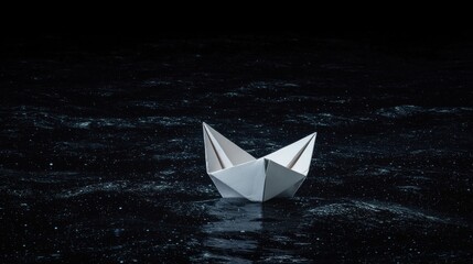Obraz premium White Paper Boat Floats in Dark Ocean at Night, Symbolizing Adventure, Hope and Imagination