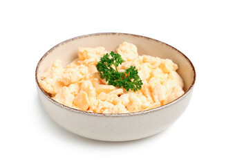 Bowl of delicious scrambled eggs on white background