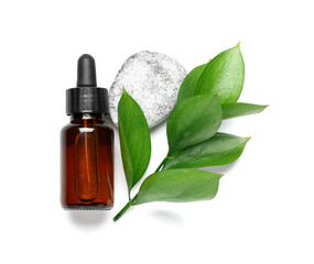 Bottle of cosmetic oil with plant twig and stone on white background