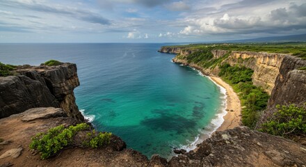 Scenic coastal view from a cliff overlooking turquoise waters and beach