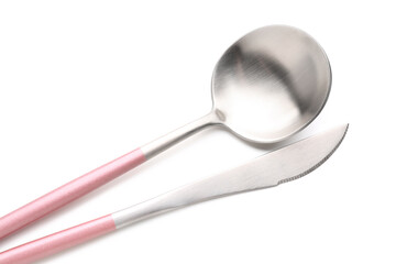Stainless steel spoon and knife with pink handles on white background