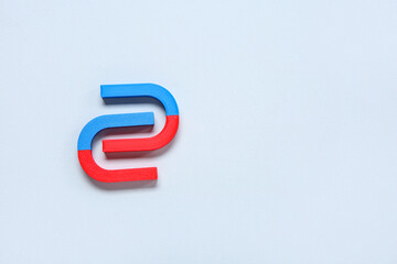 Horseshoe shaped magnets on white background