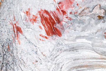 Abstract white rocks with vibrant red streaks