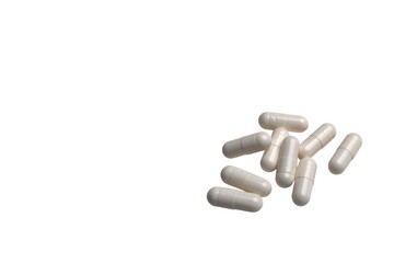 White pill capsule isolated on a white background.