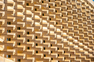 Modern building decoration with stone materials close-up. Architecture details and fragment, architecture fragment, urban city view, urban construction, architecture detail close up