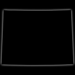 Black silhouette of Wyoming state map with glow effect on dark background