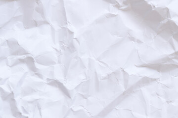 Crumpled white paper background. Crumpled white paper texture or paper background. Light background with copy space. Top view