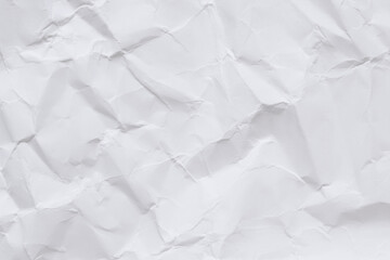 Crumpled white paper background. Crumpled white paper texture or paper background. Light background with copy space. Top view