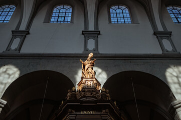 Baroque Wooden Statue in Konstanz Cathedral with Roman Numerals