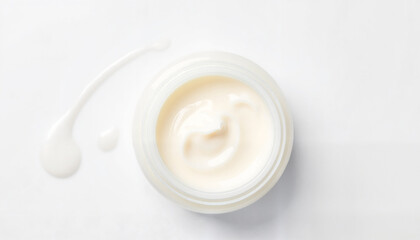 Fototapeta premium Moisturizing cream in jar with swirl on white background