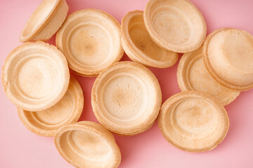 Homemade tartlets on pink background
