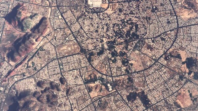 High altitude aerial top down view of Al-Masjid an-Nabawi located in Medina Saudi Arabia making the city the second-holiest site in Islam after Mecca very popular place to visit 4k animation