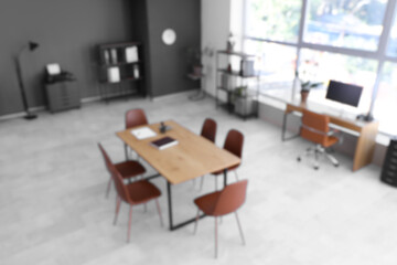 Blurred view of conference hall with tables in office