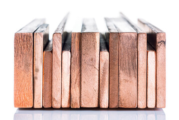 Copper bus bar arranged in a row, insulated on a white background, products of the non-ferrous metal industry