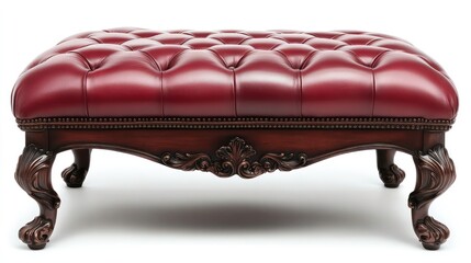 A luxurious red leather ottoman with deep button tufting and ornate carved wooden legs. Perfect for adding a touch of classic elegance to any living space. (White background)