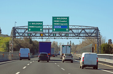Obraz premium Road signs with directions for the cities of Italy and the speed detection system