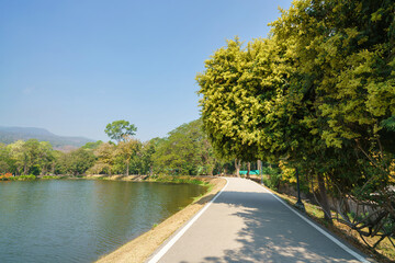 a public place leisure travel landscape lake views at Ang Kaew Chiang Mai University and Doi Suthep nature forest Mountain views spring cloudy sky background with white cloud.