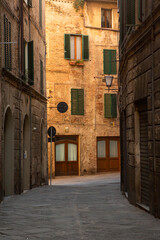 The architecture and narrow streets of the city of Siena in Italy