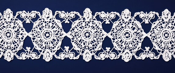 A rectangular lace with a simple yet elegant design, adorned in white against a navy blue background