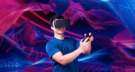 Professional gamer wearing VR headset while holding joystick at pink and purple gradient...