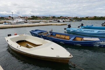 Obraz premium Nin, Croatia - September 13, 2024 - small boats in the port of Nin on a summer afternoon