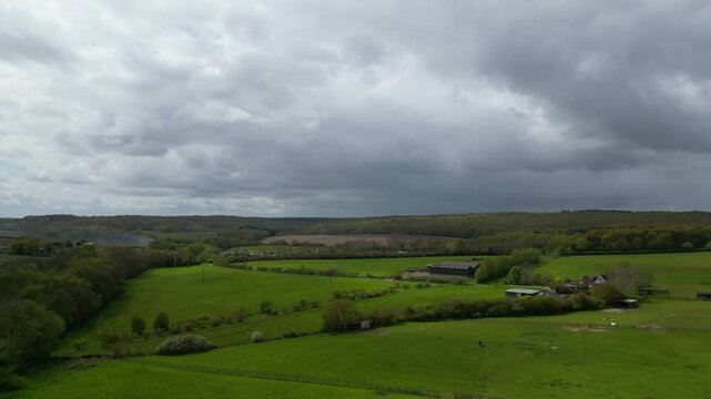 High Angle British Agricultural Farms at Gorgeous Countryside Landscape of England Great Britain of United Kingdom. Footage Was Captured with Drone's Camera from Medium High Altitude