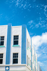 miami art deco building with blue sky and clouds