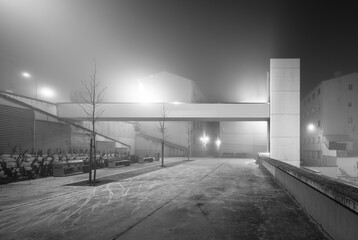 Urban elevator in misty setting, evoking mystery and isolation