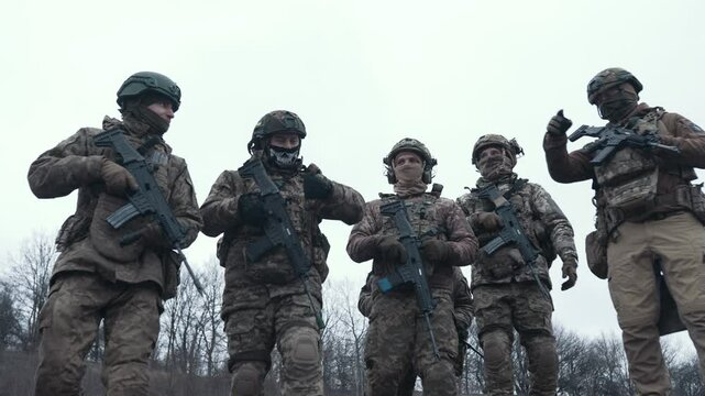 A group of Ukrainian soldiers in full ammunition near the trenches