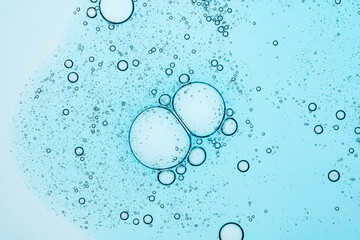 Bubbles suspended in light blue liquid creating a calm texture
