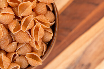 Whole Wheat Shell Pasta on a Beautiful Wooden Table