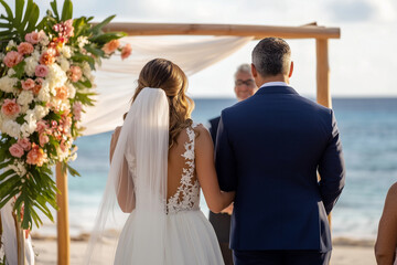 Romantic Beach Wedding Ceremony with Elegant Floral Arch, Ocean View and Bride and Groom Exchanging Vows at Sunset