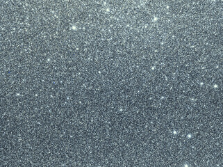 Silver sparkle background. Silver glitter background. Metallic gray glimmer. Abstract twinkle texture. Glitter surface. Glimmer layout. Holiday layout. Diamond luxury surface. Celebration background.