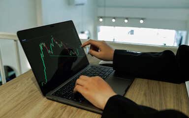 A female investor analyzes past trends, sets goals, diversifies assets, and manages risks to ensure...