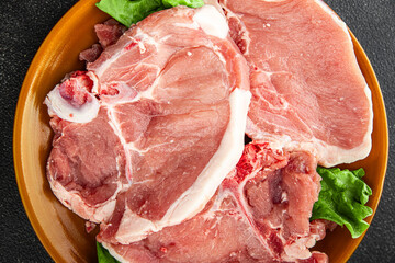 Pork on bones raw meat fresh tasty food dish delicious gourmet food background on the table rustic food top view copy space