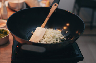 the process of cooking risotto in a frying pan