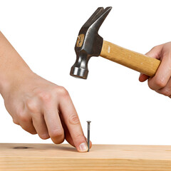 Hammering a nail into wood with a helping hand, picture on a transparent background.