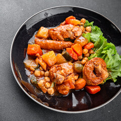 Meat ragout sausages, vegetable stew dish fresh tasty food gourmet food background on the table rustic food top view copy space