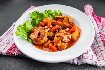Meat ragout sausages, vegetable stew dish fresh tasty food gourmet food background on the table rustic food top view copy space
